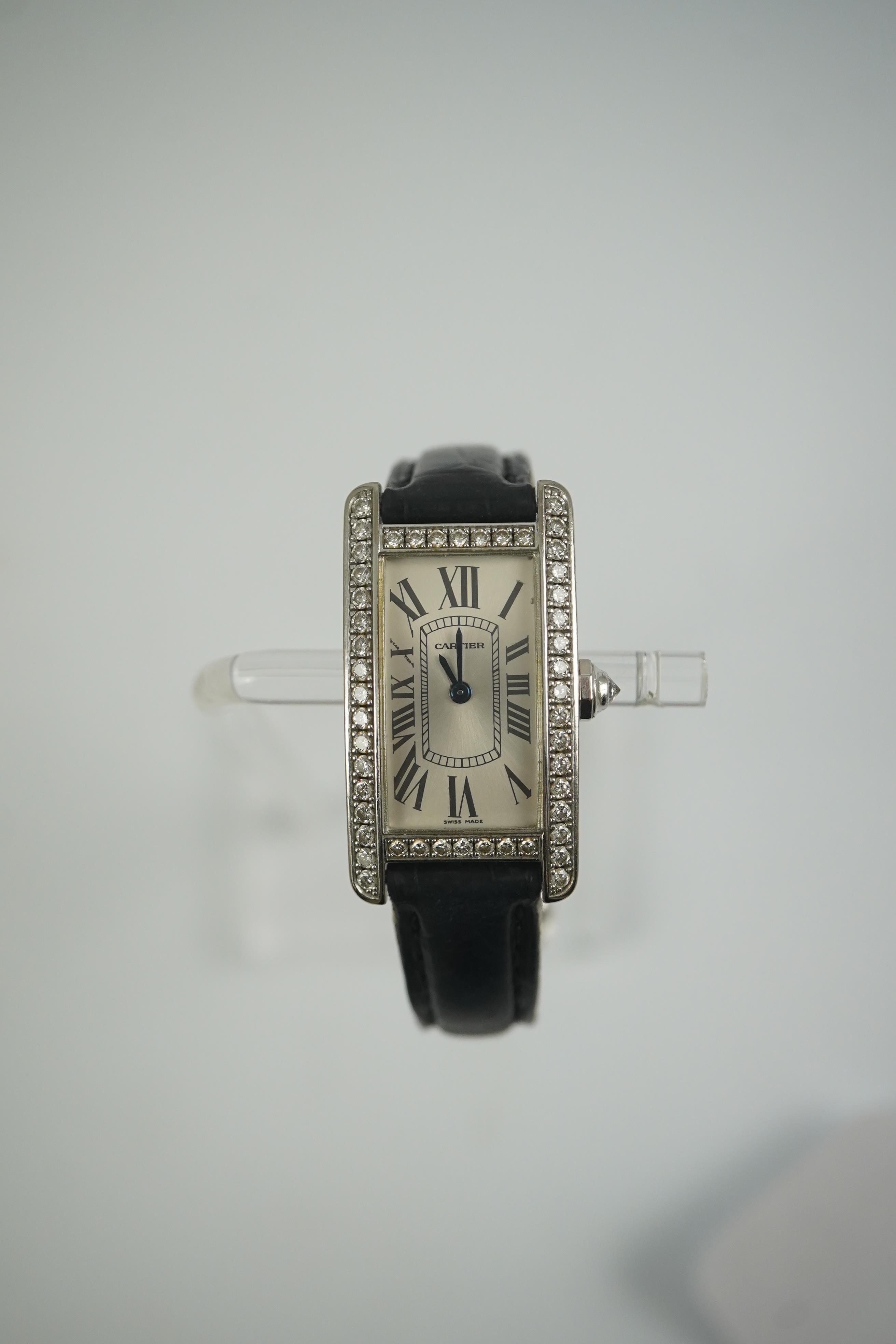 A lady's modern 18ct white gold and diamond set Cartier Tank Americaine quartz wrist watch